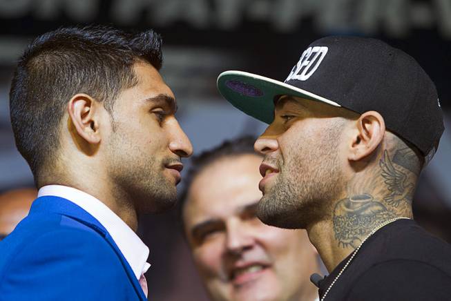 Welterweight boxers Amir Khan, left, of Britain and Luis Collazo during a news conference for undercard boxers at the MGM Grand Thursday, May 1, 2014. The boxers will fight at the MGM Grand Garden Arena on Saturday.
