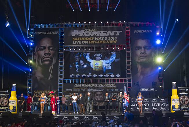WBA welterweight champion Marcos Maidana of Argentina is shown on a video screen as he arrives for an official weigh-in at the MGM Grand Garden Arena Friday, May 2, 2014. Maidana faces WBC welterweight champion Floyd Mayweather Jr.  in a WBC/WBA unification fight at the arena on Saturday.