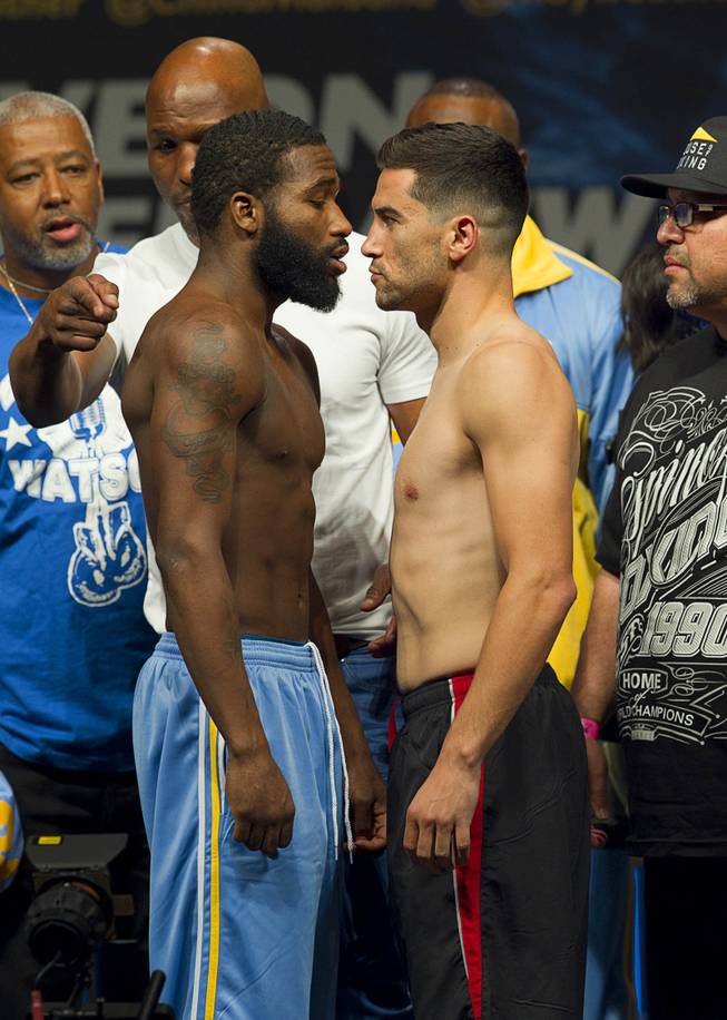 Adrien Broner, left, and Carlos Molina face off during an official weigh-in at the MGM Grand Garden Arena Friday, May 2, 2014. The boxers will fight in a super lightweight bout at the arena on Saturday.