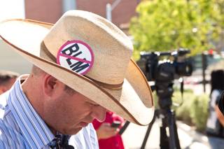 Ammon Bundy, son Cliven Bundy, prepares to speak with the media during a peaceful protest in front of the Metro Police department, Friday May 2, 2014.