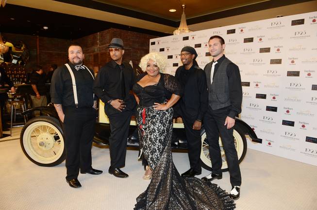 Skye Dee Miles and her men arrive at the grand opening of 1923 Bourbon & Burlesque by Holly Madison at Mandalay Bay on Thursday, May 1, 2014, in Las Vegas.