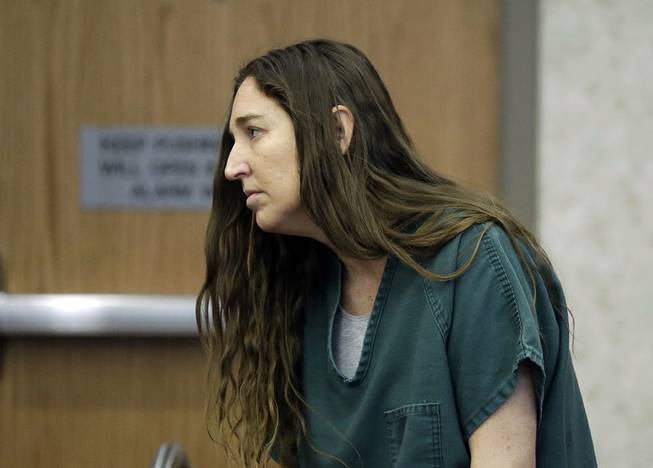 Megan Huntsman, accused of killing six of her babies and storing their bodies in her garage, appears in court Monday, April 28, 2014, in Provo, Utah.