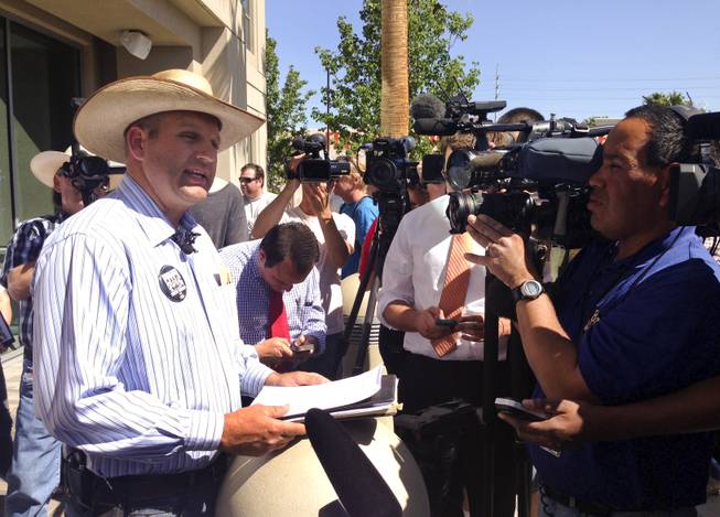 Ammon Bundy, one of Cliven Bundy's sons, talks to the media during a rally held by the Bundy family at Metro headquarters Friday, May 2, 2014.