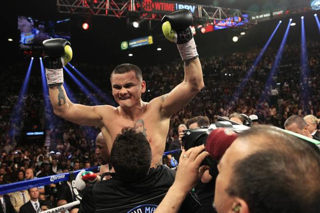 Marcos Maidana of Argentina celebrates after a WBC/WBA welterweight unification fight against Floyd Mayweather Jr. of the U.S. at the MGM Grand Garden Arena on Saturday, May 3, 2014.