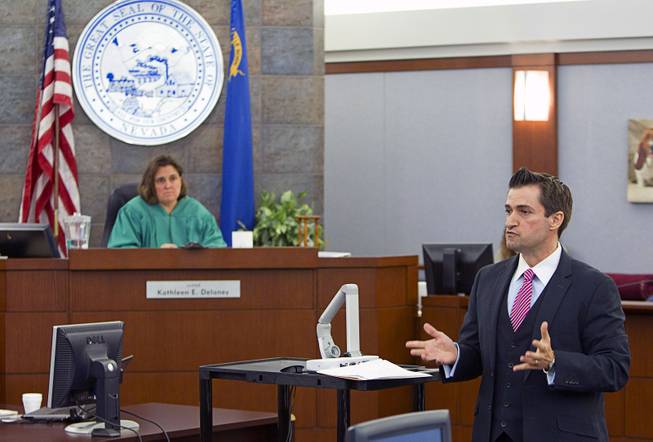 Defense attorney Abel Yanez , right, speaks to potential jurors as jury selection begins in the trial for Jason "Blu" Griffith, the man accused of killing Luxor "Fantasy" dancer Debora Flores Narvaez, at the Regional Justice Center Monday, May 5, 2014. District Court Judge Kathleen Delaney is in the background.