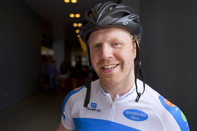 James Lyne, global head of security research at Sophos, poses before going "war biking" in Las Vegas Monday, May 5, 2014. His bicycle is equipped with a scanner and computer that can detect Wi-Fi networks.