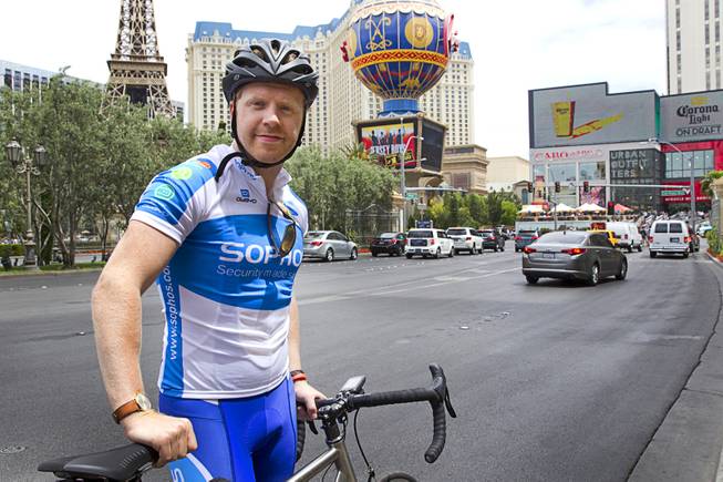 James Lyne, global head of security research at Sophos, poses before going "war biking" on the Las Vegas Strip Monday, May 5, 2014. His bicycle is equipped with a scanner and computer that can detect Wi-Fi networks.