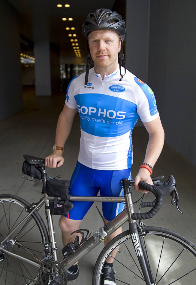 James Lyne, global head of security research at Sophos, prepares to go "war biking" in Las Vegas Monday, May 5, 2014. His bicycle is equipped with a scanner and computer that can detect Wi-Fi networks.