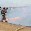 The construction site of the Ranchero Interchange Bridge at Interstate 15 was engulfed in flames Monday, May 5, 2014, in Hesperia, Calif. The California Highway Patrol's Carlos Juarez says the bridge at Ranchero Road caught fire about 1:30 p.m., and I-15 was closed soon after because of falling debris.