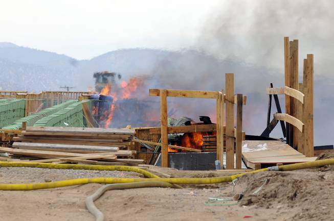 The construction site of the Ranchero Interchange Bridge at Interstate 15 was engulfed in flames on Monday, May 5, 2014, in Hesperia, Calif. The California Highway Patrol's Carlos Juarez says the bridge at Ranchero Road caught fire at about 1:30 p.m. and Interstate 15 was closed soon after because of falling debris.