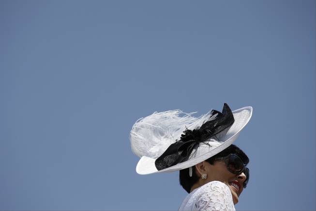 Sharon Ainslie looks around the paddock before the 140th running of the Kentucky Derby horse race at Churchill Downs Saturday, May 3, 2014, in Louisville, Ky. (AP Photo/David J. Phillip)