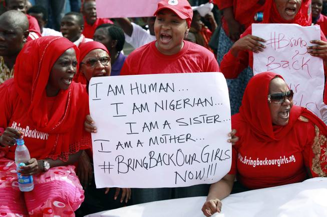 Women attend a demonstration calling on the government to rescue the kidnapped school girls of a government secondary school Chibok, outside the defense headquarters in Abuja, Nigeria, Tuesday May 6, 2014. 