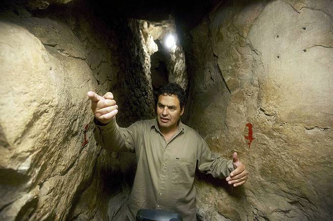 Eli Shukron, an archeologist formerly with Israel's Antiquities Authority, walks in the City of David archaeological site near Jerusalem's Old City, May 1, 2014. 