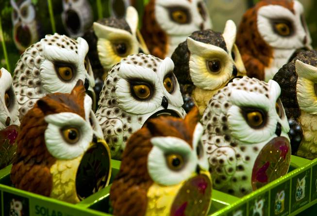 Solar-powered owls from Tianjin HC Hardware Products are lined up on display at the National Hardware Show 2014 in the Las Vegas Convention Center on Wednesday, May 7, 2014.   L.E. Baskow