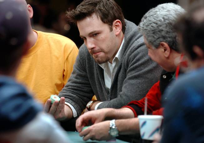 Actor Ben Affleck plays a hand of poker during The Showdown at the Sands, a $1 million poker tournament, at the Sands Casino Hotel in Atlantic City, N.J., Saturday, Nov. 22, 2003. 