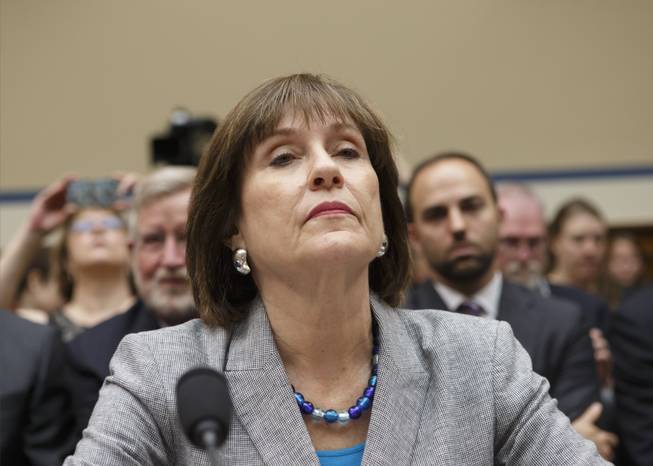 In this May 22, 2013, file photo, Internal Revenue Service official Lois Lerner refuses to answer questions as the House Oversight Committee holds a hearing to investigate the extra scrutiny the IRS gave Tea Party and other conservative groups that applied for tax-exempt status, on Capitol Hill in Washington.