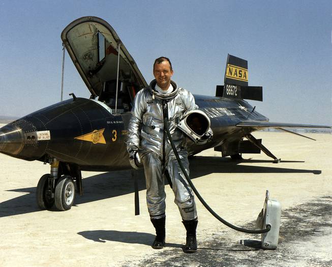 This 1967 file image provided by NASA shows research pilot Bill Dana in front of the X-15 on the dry lake bed at the Dryden Flight Research Center at Edwards Air Force Base, Calif. Dana, the famed research test pilot who flew the X-15 rocket plane and other pioneering aircraft, died Tuesday, May 6, 2014. He was 83.