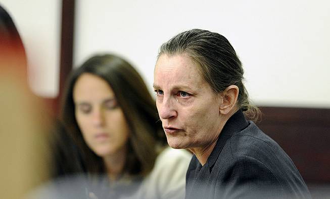 Julie Schenecker talks with attorney Jennifer Spradley on Tuesday, May 6, 2014, prior to the start of day 2 of her trial in Tampa, Fla. Schenecker is accused of killing her two children Calyx, 16, and Beau Schenecker, 13 in 2011.