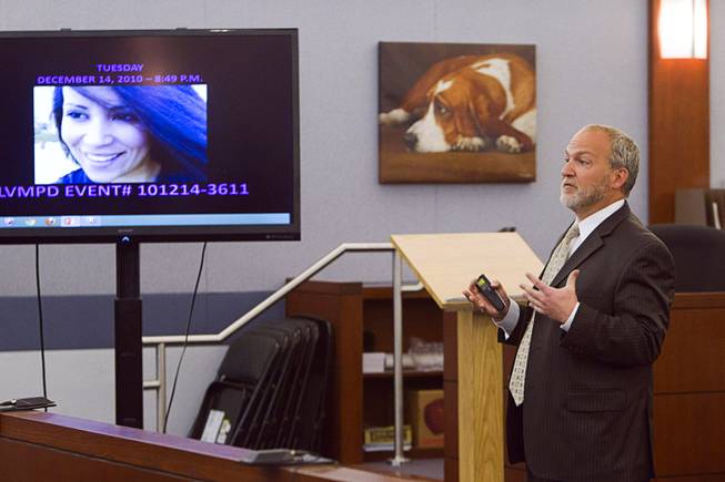 Prosecutor Marc DiGiacomo gives opening statements during the trial for Jason Omar Griffith at the Regional Justice Center Thursday, May 8, 2014. Griffith is accused of murdering Luxor "Fantasy" dancer Deborah Flores Narvaez in December 2010. A photo of Narvaez is displayed on the video monitor.