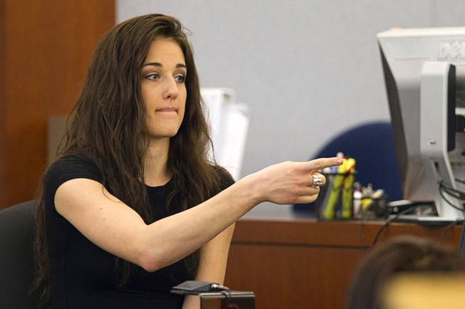 Sonya Sonnenberg, roommate of Deborah Flores Narvaez, points to defendant Jason Omar Griffith as she testifies during his trial at the Regional Justice Center Thursday, May 8, 2014. Griffith is accused of murdering Luxor "Fantasy" dancer Deborah Flores Narvaez in December 2010.
