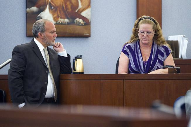 Prosecutor Marc DiGiacomo, left, stand by witness Theresa Howey during a trial for Jason Omar Griffith at the Regional Justice Center Thursday, May 8, 2014. Griffith is accused of murdering Luxor "Fantasy" dancer Deborah Flores Narvaez in December 2010. Howey is the person who reported Narvaez' car abandoned in a lot near her house.