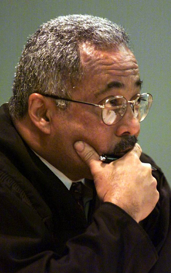 Clark County District Court Judge Michael Douglas listens during a hearing before the start ofskinhead gang member John Edward Butler's murder trial Thursday, Dec. 7, 2000 at the Clark County Courthouse.