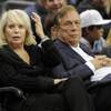 Los Angeles Clippers owner Donald Sterling sits with his wife, Shelly, during a Clippers game against the Detroit Pistons in Los Angeles. 