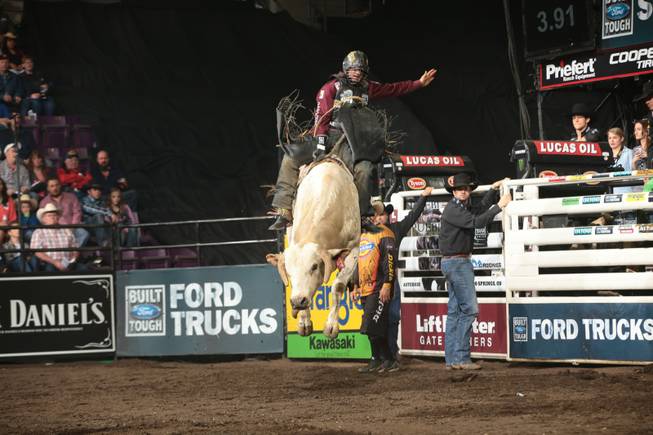 Markus Mariluch rides Frontier Rodeo Company's Good Time Charlie for 76.5 during the first round of the Colorado Springs Built Ford Tough series PBR. Photo by Andy Watson