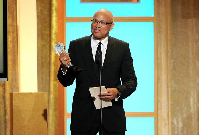 Larry Wilmore accepts the best talk show award for "The Daily Show With Jon Stewart" at the Critics' Choice Television Awards in the Beverly Hilton Hotel on Monday, June 10, 2013, in Beverly Hills, Calif. 