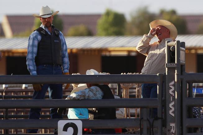 A cowboy laughs during the chute dogging competition during the Bighorn Rodeo Saturday, May 10, 2014. The Bighorn Rodeo is an annual event put on by the Nevada Gay Rodeo Association.