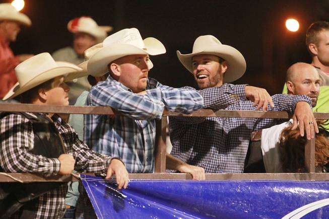 Cowboys watch the competition from the fence during the Bighorn Rodeo Saturday, May 10, 2014. The Bighorn Rodeo is an annual event put on by the Nevada Gay Rodeo Association.
