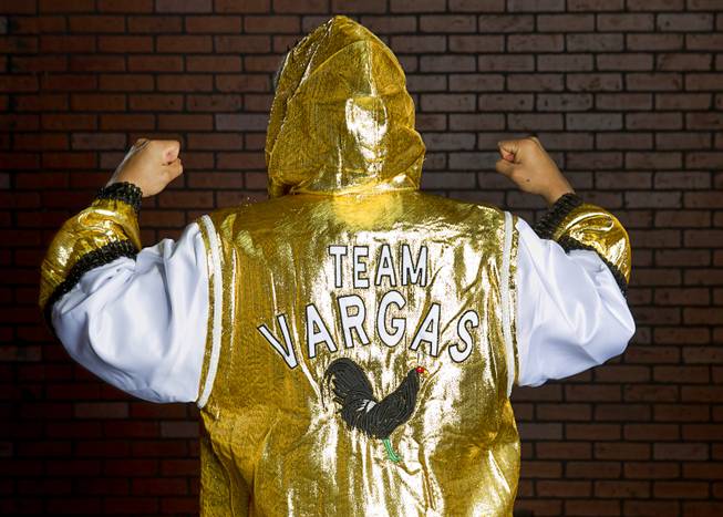 Las Vegan Jessie Vargas show the back of his robe before a workout at Top Rank Gym Monday, May 12, 2014. Vargas defeated Khabib Allakhverdiev of Russia at the MGM Grand Garden Arena on April 12 to take the WBA super lightweight (140 lbs.) title. Allakhverdiev was previously undefeated.