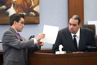 Defense attorney Abel Yanez, left, questions Louis Colombo, 35, a former housemate of Jason Omar Griffith, during Griffith's trial at the Regional Justice Center Tuesday, May 13, 2014. Colombo testified he helped Griffith dispose of the body of Luxor 