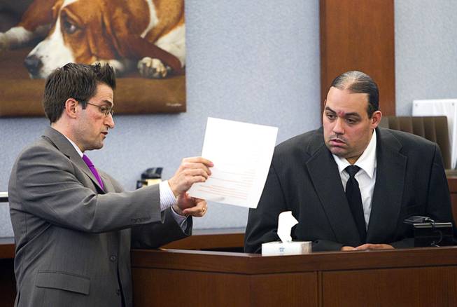 Defense attorney Abel Yanez, left, questions Louis Colombo, 35, a former housemate of Jason Omar Griffith, during Griffith's trial at the Regional Justice Center Tuesday, May 13, 2014. Colombo testified he helped Griffith dispose of the body of Luxor "Fantasy" dancer Deborah Flores Narvaez in 2010.