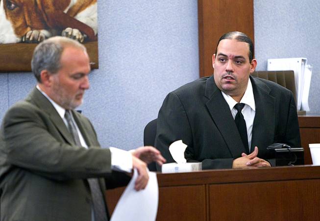 Louis Colombo, right, 35, a former housemate of Jason Omar Griffith, responds to a question from prosecutor Marc DiGiacomo during Griffith's trial at the Regional Justice Center Tuesday, May 13, 2014. Colombo testified he helped Griffith dispose of the body of Luxor "Fantasy" dancer Deborah Flores Narvaez in 2010.