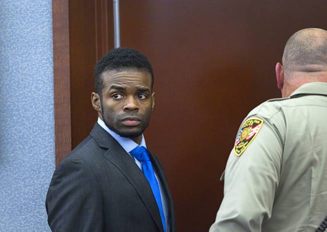 Jason Omar Griffith, left, leaves the courtroom during a break in his trial at the Regional Justice Center Tuesday, May 13, 2014. Griffith is accused of murdering Luxor "Fantasy" dancer Deborah Flores Narvaez in December 2010.