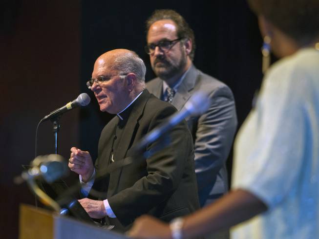 Bishop Joseph Pepe is joined by Rabbi Sanford Akselrad to announce the next steps and call to order during the Nevadans for the Common Good second community convention at the Cashman Center on Tuesday, May 13, 2014. Pepe is with the Roman Catholic Diocese of Las Vegas and Akselrad with Congregation Ner Tamid.