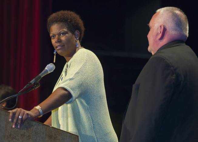 Rev. Camille D. Pentsil and Re. Bob Stoeckig call to order the Nevadans for the Common Good second community convention at the Cashman Center on Tuesday, May 13, 2014.  They are event co-chairs, she is with Zion United Methodist Church and he with St. Andrew Catholic Community Church.