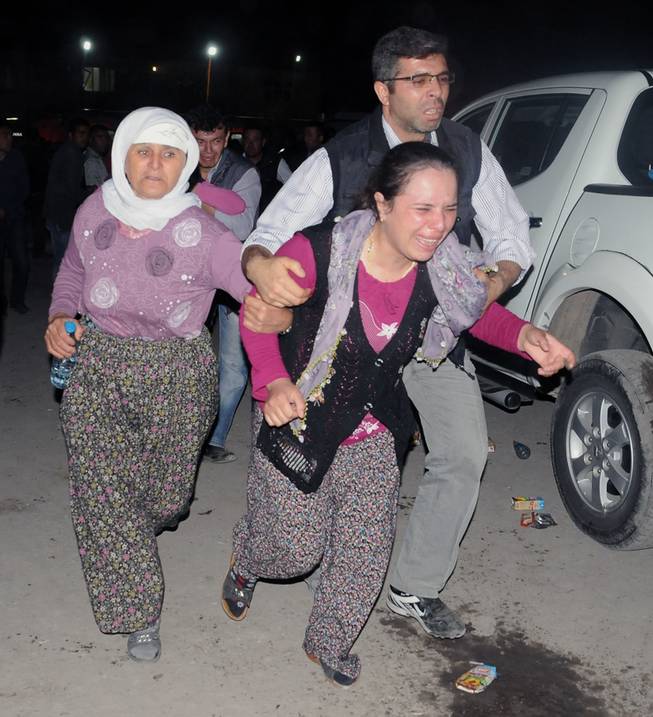 Family members cry as they wait outside a hospital hours after an explosion and fire at a coal mine killed at least 17 miners and left up to 300 workers trapped underground, in Soma, in western Turkey, Tuesday, May 13, 2014, a Turkish official said.