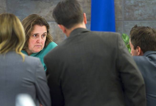 Judge Kathleen Delaney, left, confers with attorneys during a trial for Jason Omar Griffith at the Regional Justice Center Wednesday, May 14, 2014. Griffith is accused of murdering Luxor "Fantasy" dancer Deborah Flores Narvaez in December 2010.