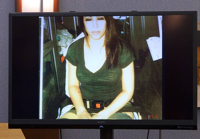 A photo on a video monitor shows Deborah Flores Narvaez during Jason Omar Griffith's trial at the Regional Justice Center Wednesday, May 14, 2014. The photo was taken in an ambulance after she broke his bedroom window, Griffith said. Griffith is accused of murdering Flores Narvaez in December 2010.