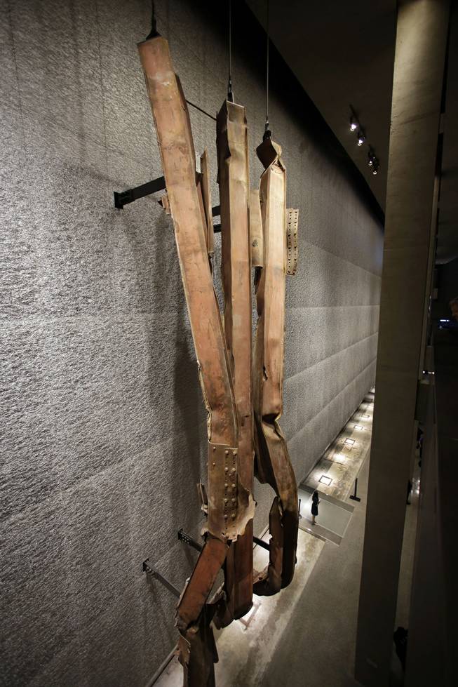 A section of steel facade, from floors 96-99 of the north tower of the World Trade Center, is displayed at the National Sept. 11 Memorial Museum, Wednesday, May 14, 2014, in New York. The museum is a monument to how the Sept. 11 terror attacks shaped history, from its heart-wrenching artifacts to the underground space that houses them amid the remnants of the fallen twin towers' foundations. It also reflects the complexity of crafting a public understanding of the terrorist attacks and reconceiving ground zero.  (AP Photo)