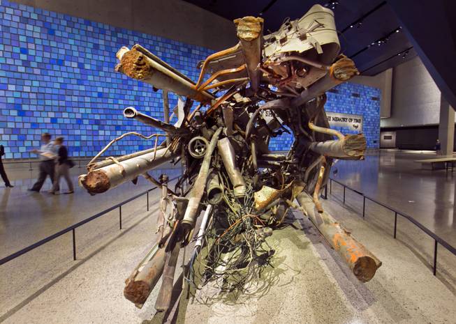 The twisted remains of a portion of the television transmission tower from the World Trade Center is displayed at the National Sept. 11 Memorial Museum, Wednesday, May 14, 2014, in New York. The museum is a monument to how the Sept. 11 terror attacks shaped history, from its heart-wrenching artifacts to the underground space that houses them amid the remnants of the fallen twin towers' foundations. It also reflects the complexity of crafting a public understanding of the terrorist attacks and reconceiving ground zero.  (AP Photo)