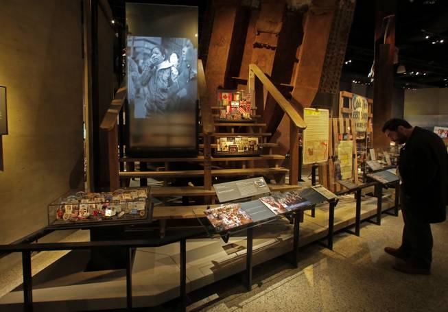 The Family Viewing Platform, and memorabilia from the World Trade Center, are displayed at the National Sept. 11 Memorial Museum, Wednesday, May 14, 2014, in New York. The museum is a monument to how the Sept. 11 terror attacks shaped history, from its heart-wrenching artifacts to the underground space that houses them amid the remnants of the fallen twin towers' foundations. It also reflects the complexity of crafting a public understanding of the terrorist attacks and reconceiving ground zero.  (AP Photo)