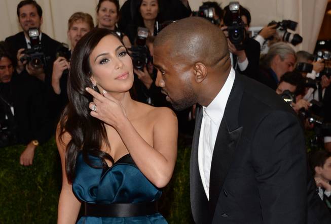 Kim Kardashian and Kanye West attend the Metropolitan Museum of Art's Costume Institute benefit gala celebrating "Charles James: Beyond Fashion" on Monday, May 5, 2014, in New York.