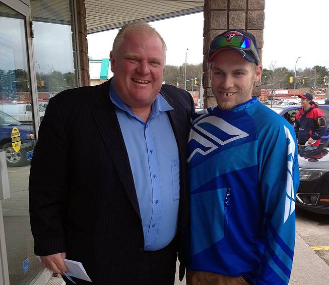 In this photo provided by Brody Lisle, Toronto Mayor Rob Ford poses for a photo with him in Bracebridge, Ontario, Canada on Friday, May 16, 2014. 