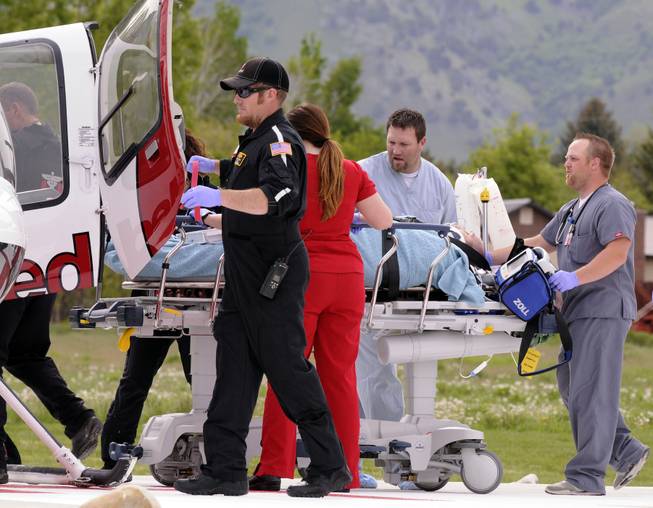 Jason Burr is loaded into an AirMed helicopter to be transported to another hospital after he entered the Cache Valley Hospital with a gun and was shot by law enforcement, Friday, May 16, 2014, in North Logan, Utah.