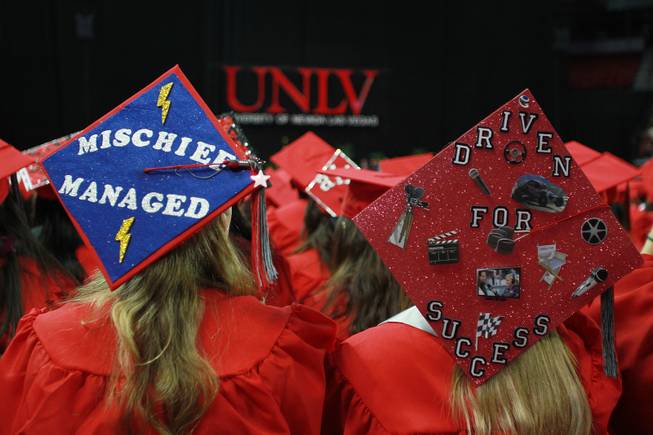 UNLV students display decorated mortar boards during commencement ceremonies Saturday, May 17, 2014.