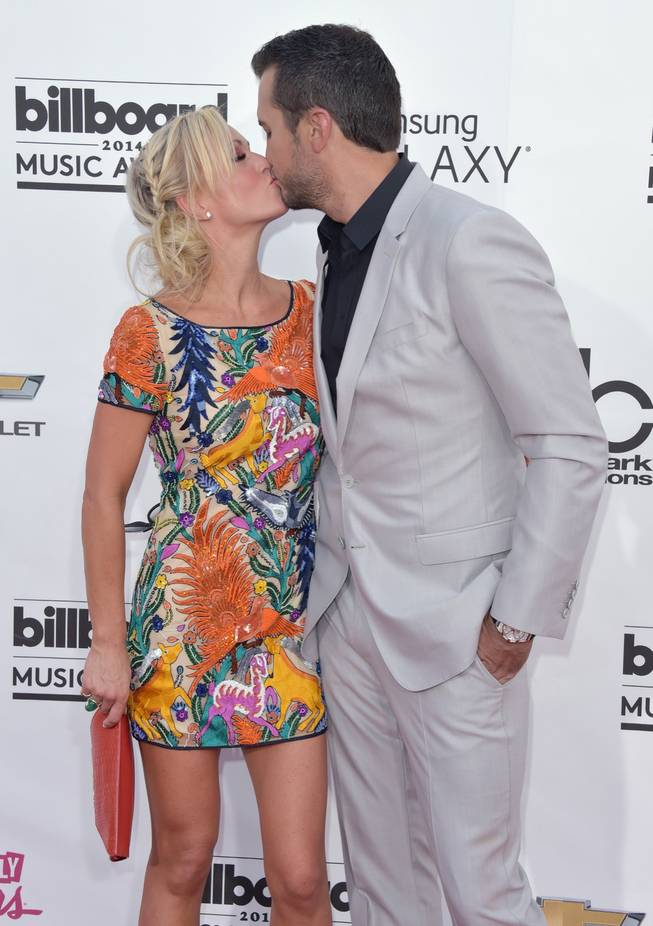 Caroline Boyer and Luke Bryan arrive at the 2014 Billboard Music Awards at MGM Grand Garden Arena on Sunday, May 18, 2014, in Las Vegas.
