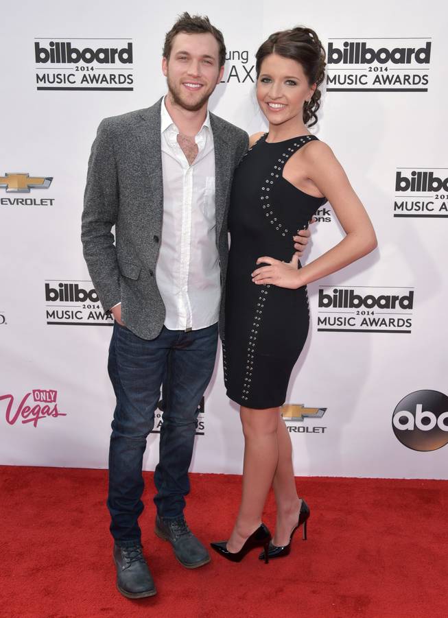 Phillip Phillips and Hannah Blackwell arrive at the 2014 Billboard Music Awards at MGM Grand Garden Arena on Sunday, May 18, 2014, in Las Vegas.